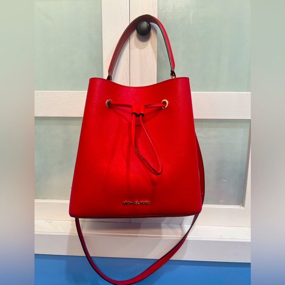 Used Michael Kors red bucket bag w/ crossbody option!